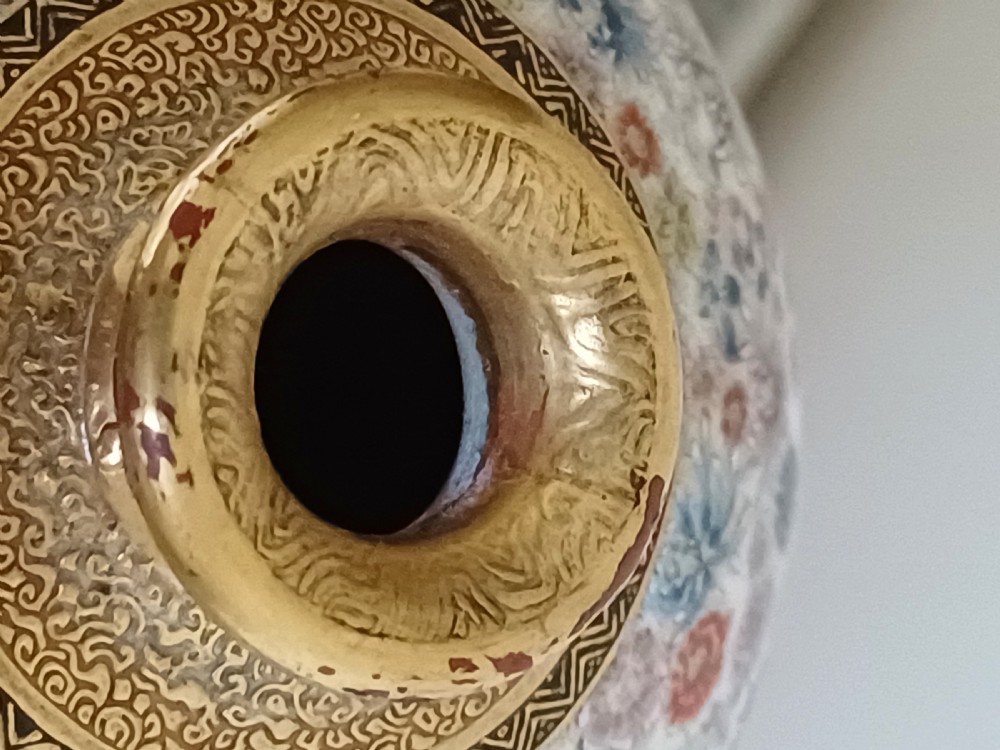 A Meiji period Satsuma earthenware vase featuring a thousand flowerhead pattern surrounding a reserve with figures in traditional Japanese dress. View XXVI