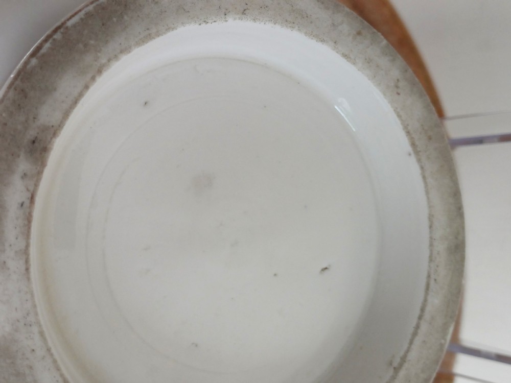 A small round ivory white glazed porcelain censer featuring moulded mask handles on either side and a short flared foot base. View XIX