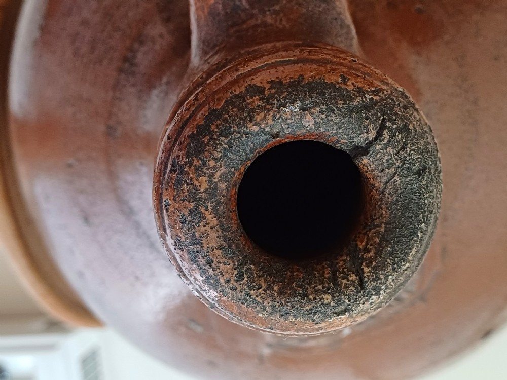A large bulbous brown salt-glazed stoneware flagon with a narrow neck and single curved loop handle. View XIV