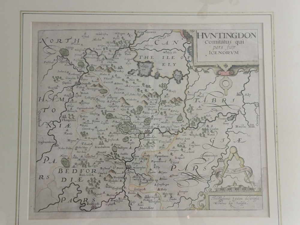 A framed 17th-century hand-coloured map of Huntingdon by Christopher Saxton set within an off-white mount and slim gilded frame. View II