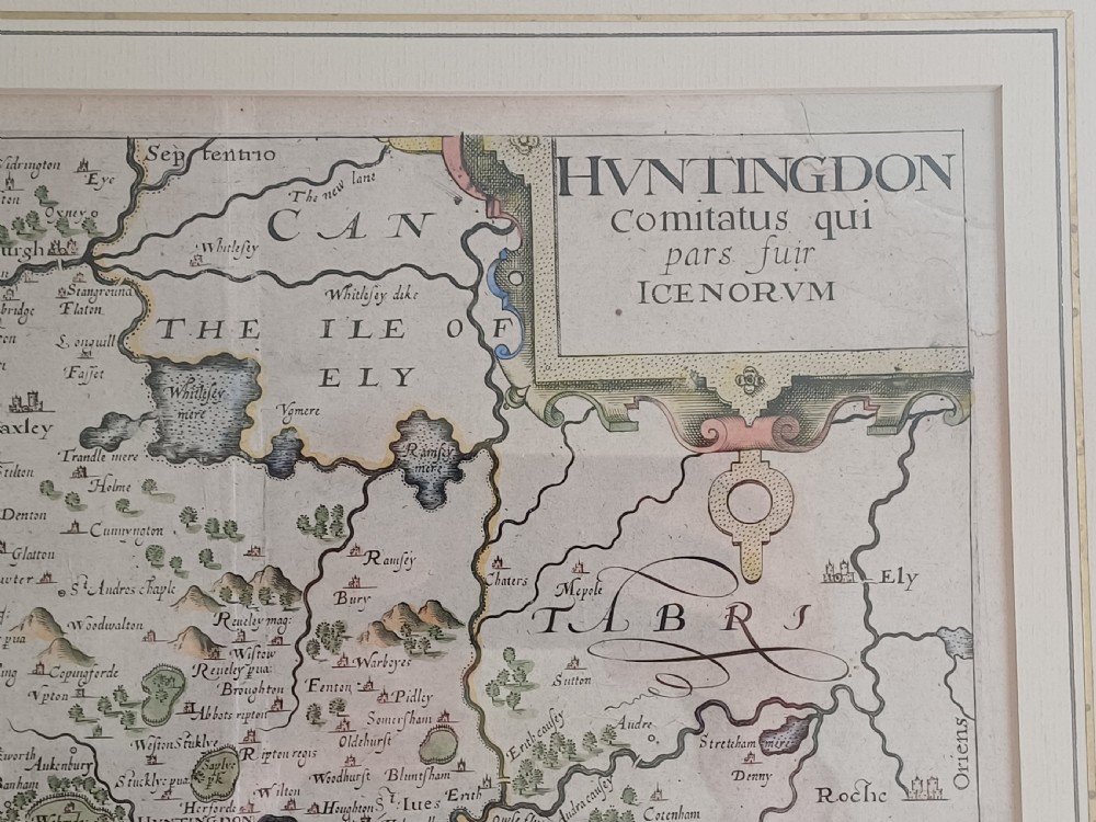 A framed 17th-century hand-coloured map of Huntingdon by Christopher Saxton set within an off-white mount and slim gilded frame. View IV