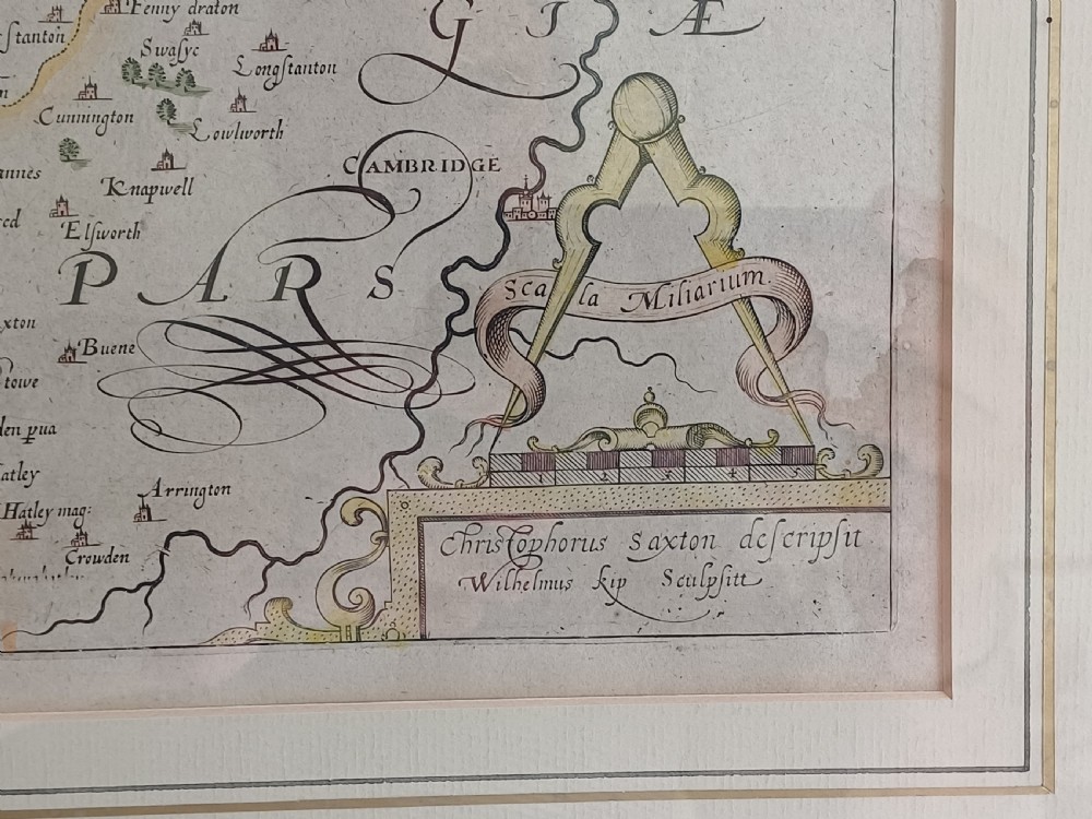 A framed 17th-century hand-coloured map of Huntingdon by Christopher Saxton set within an off-white mount and slim gilded frame. View V