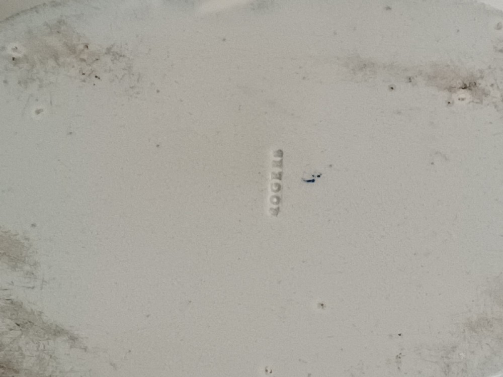 A Georgian blue and white transfer-printed ceramic sauce tureen featuring floral patterns, lion head side handles, a lion finial lid, and a matching underplate. View IX