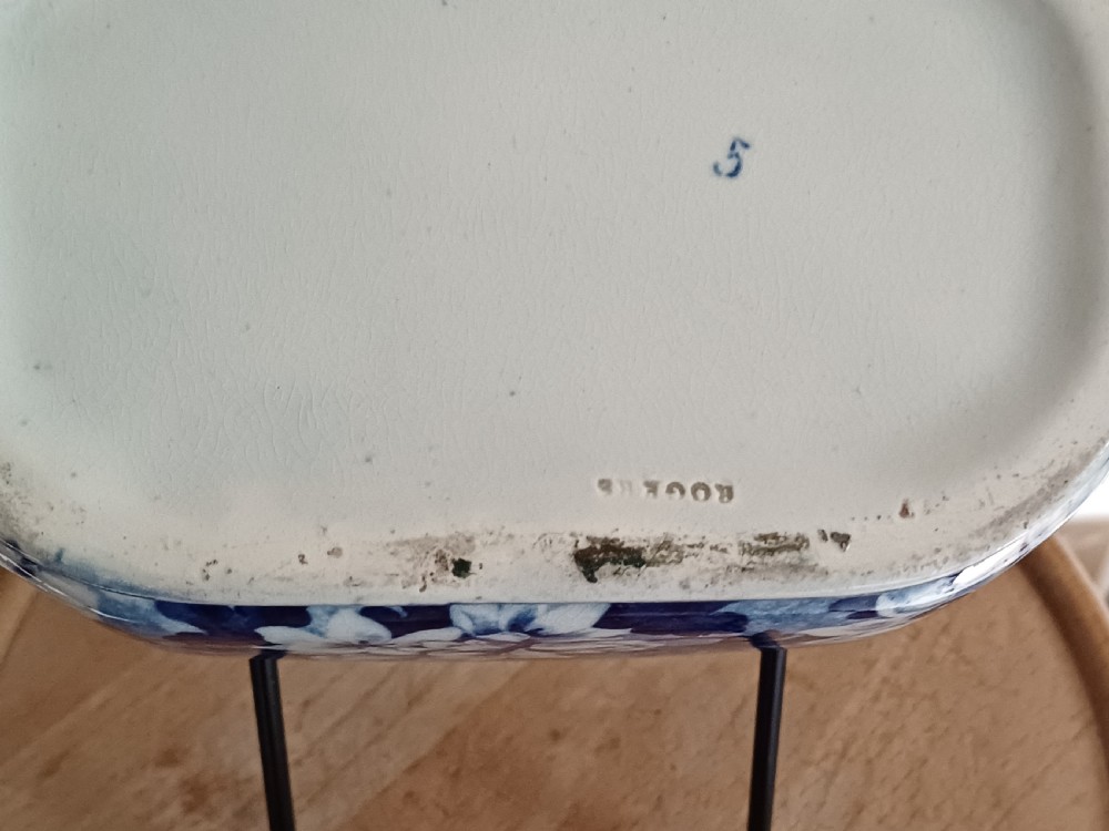 A Georgian blue and white transfer-printed ceramic sauce tureen featuring floral patterns, lion head side handles, a lion finial lid, and a matching underplate. View XIII