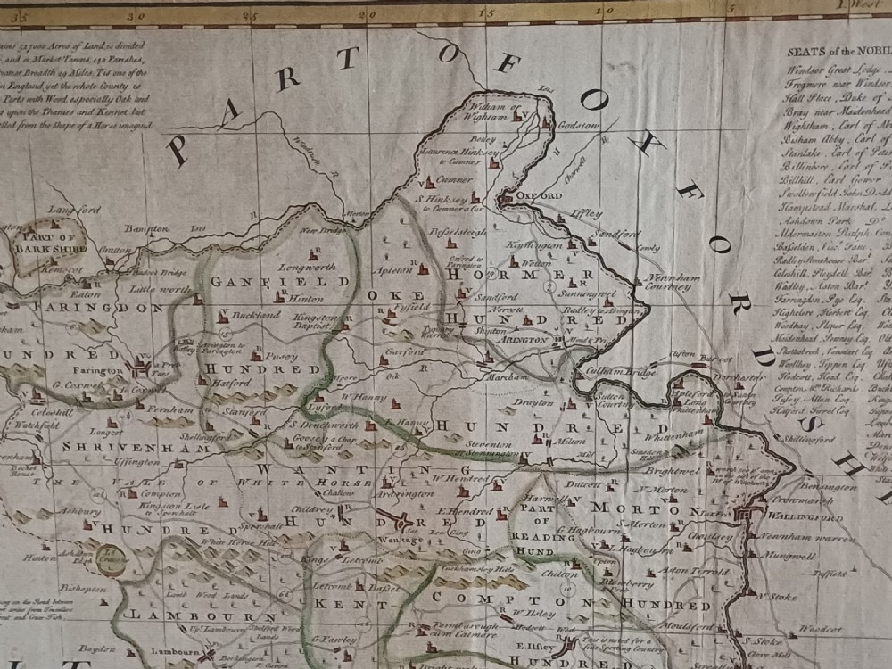 A framed 18th-century hand-coloured map of Berkshire by Emanuel Bowen featuring historical text cartouches and a dark wooden frame. View IV
