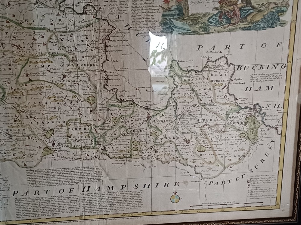 A framed 18th-century hand-coloured map of Berkshire by Emanuel Bowen featuring historical text cartouches and a dark wooden frame. View X
