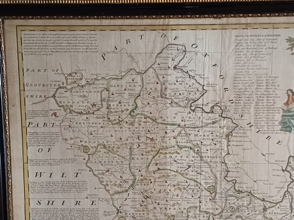 A framed 18th-century hand-coloured map of Berkshire by Emanuel Bowen featuring historical text cartouches and a dark wooden frame. View XI