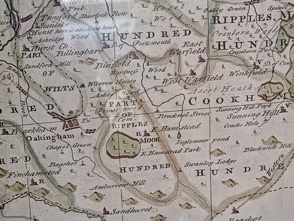 A framed 18th-century hand-coloured map of Berkshire by Emanuel Bowen featuring historical text cartouches and a dark wooden frame. View XII