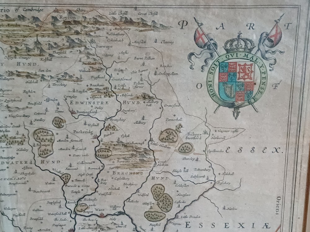 A framed 17th-century hand-coloured map of Hertfordshire by cartographer Jan Blaeu featuring decorative heraldic coats of arms and a title cartouche. View II