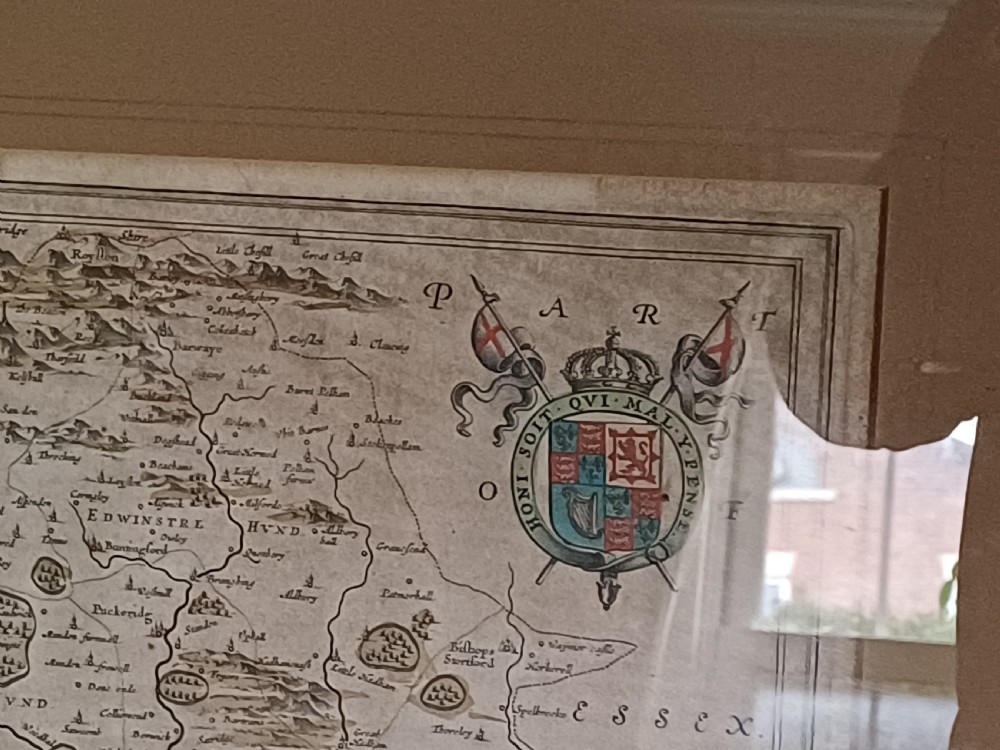 A framed 17th-century hand-coloured map of Hertfordshire by cartographer Jan Blaeu featuring decorative heraldic coats of arms and a title cartouche. View XIV