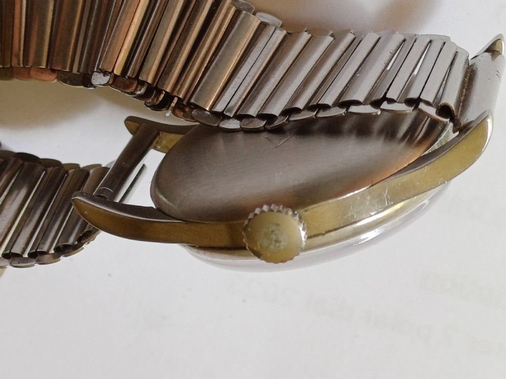 Vintage Omega 6B159 military pilot wristwatch with a cream dial, Arabic numerals, and a stainless steel case. View XIX