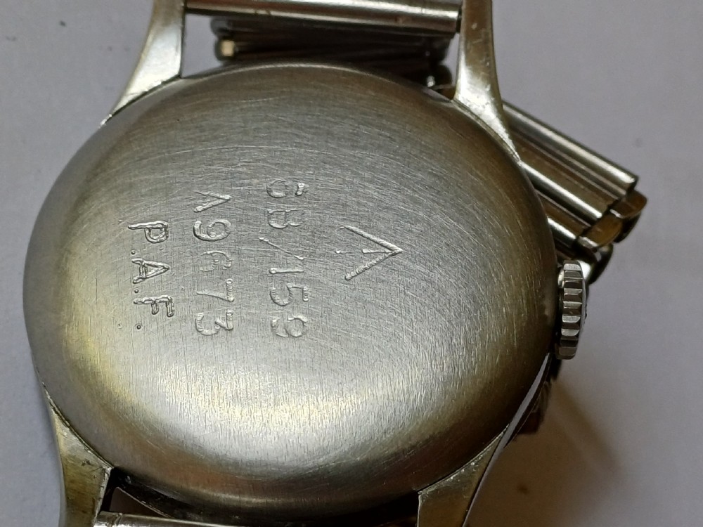 Vintage Omega 6B159 military pilot wristwatch with a cream dial, Arabic numerals, and a stainless steel case. View XXVI