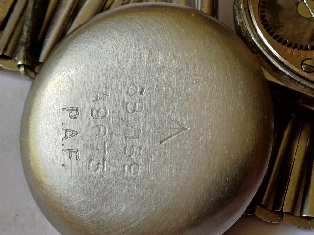 Vintage Omega 6B159 military pilot wristwatch with a cream dial, Arabic numerals, and a stainless steel case. View XXIX