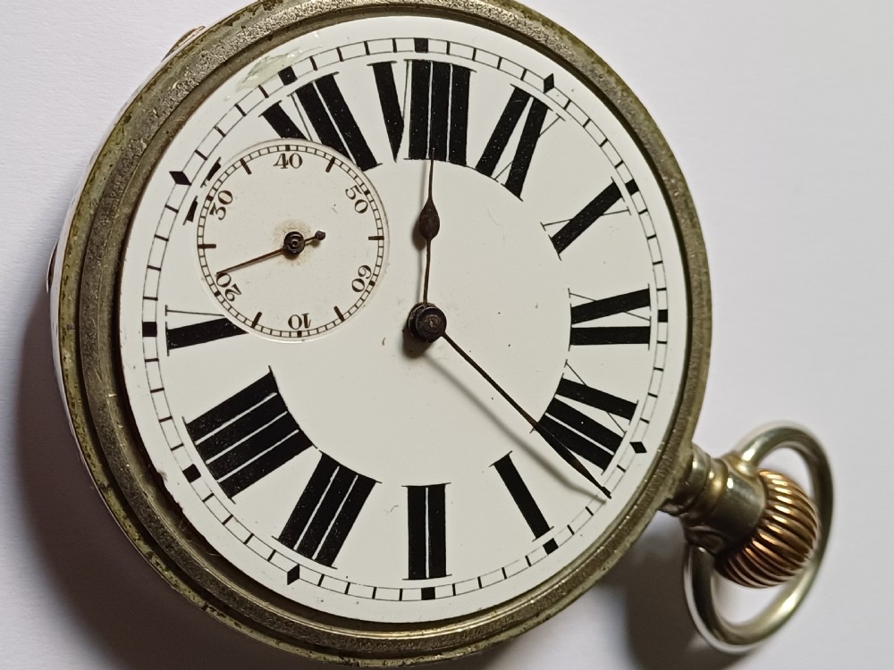 An antique open-face silver pocket watch featuring a white enamel dial with bold black Roman numerals and a subsidiary seconds dial. View V