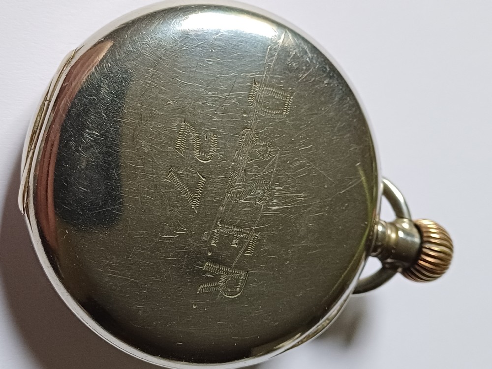An antique open-face silver pocket watch featuring a white enamel dial with bold black Roman numerals and a subsidiary seconds dial. View VIII