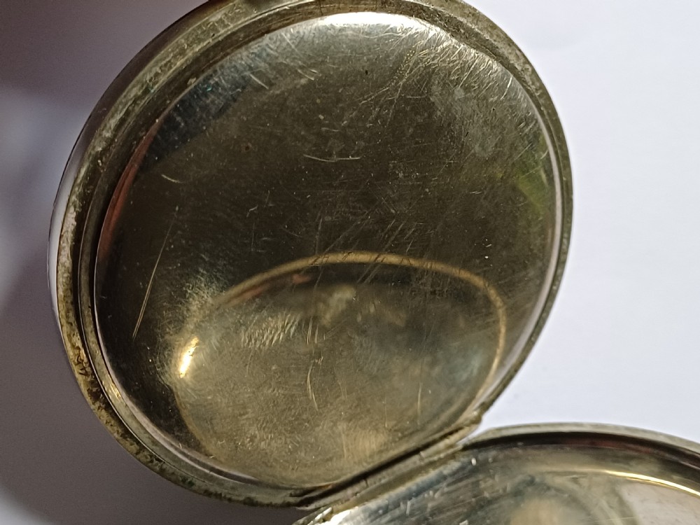 An antique open-face silver pocket watch featuring a white enamel dial with bold black Roman numerals and a subsidiary seconds dial. View XI