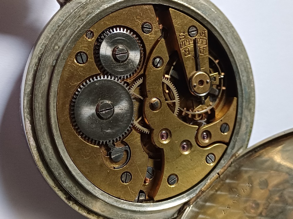 An antique open-face silver pocket watch featuring a white enamel dial with bold black Roman numerals and a subsidiary seconds dial. View XIV