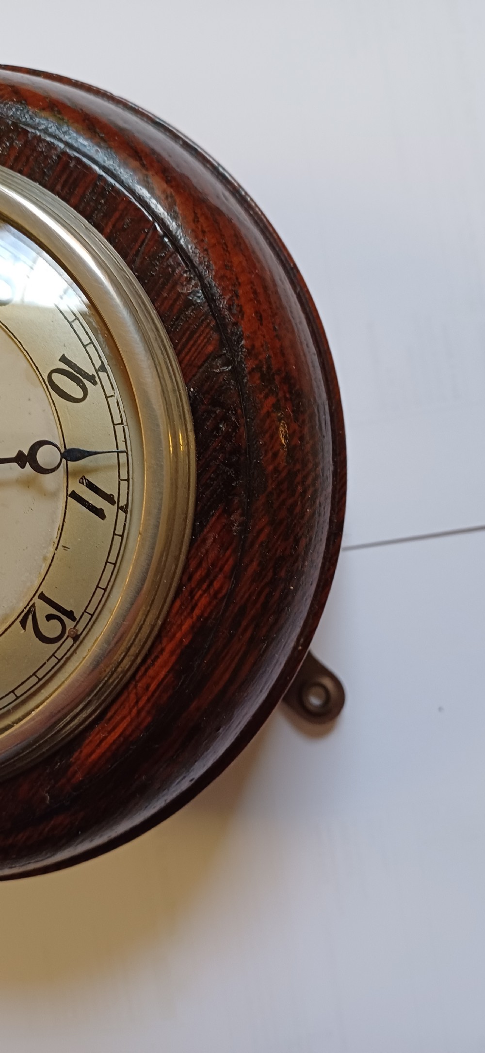A circular dark oak GWR signal box clock featuring a brass bezel, glass face cover, cream dial with Arabic numerals, and black clock hands. View XV
