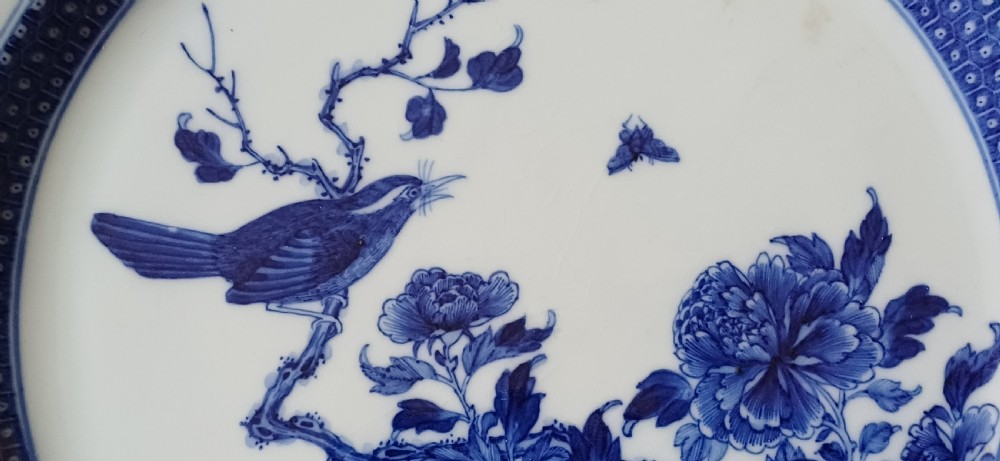 (Reserved PS) Chinese very finely painted blue and white plate decorated with a songbird and insects to the centre. Dating circa 1765.  View VII