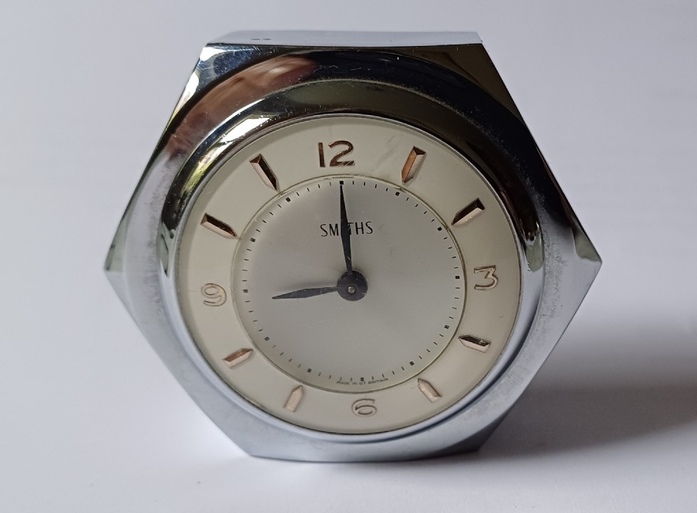 (Reserved EK) A fantastic small Smiths desk clock in the design of a motoring hexagonal wheel nut, as designed for a set of sports car wire wheels, dating circa 1940’s 
