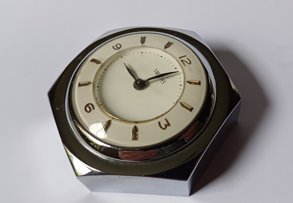 (Reserved EK) A fantastic small Smiths desk clock in the design of a motoring hexagonal wheel nut, as designed for a set of sports car wire wheels, dating circa 1940’s  View IX