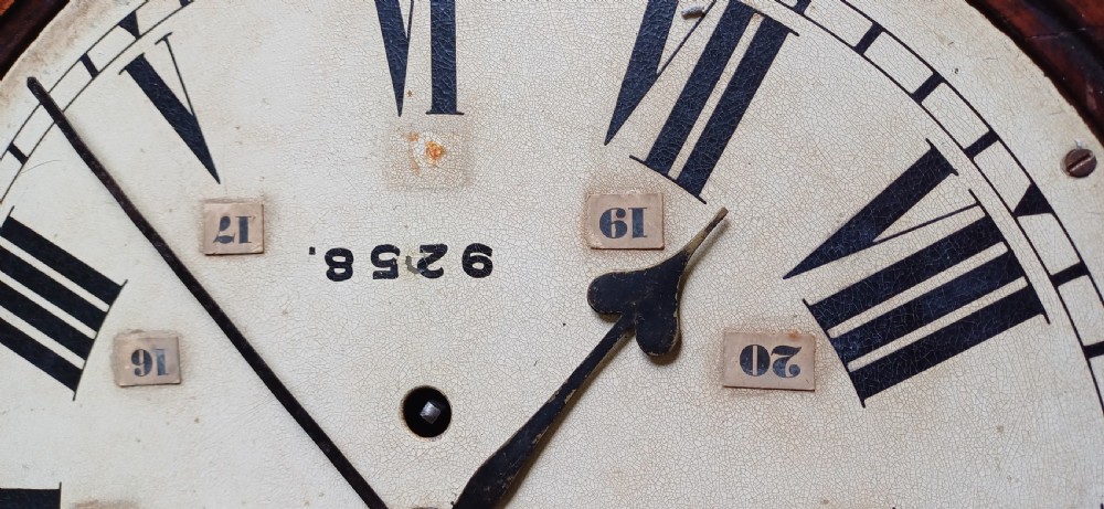 An early 20th-century round mahogany railway wall clock featuring an off-white dial with Roman numerals, secondary 24-hour markings, and B.R.(E.) lettering. View IX