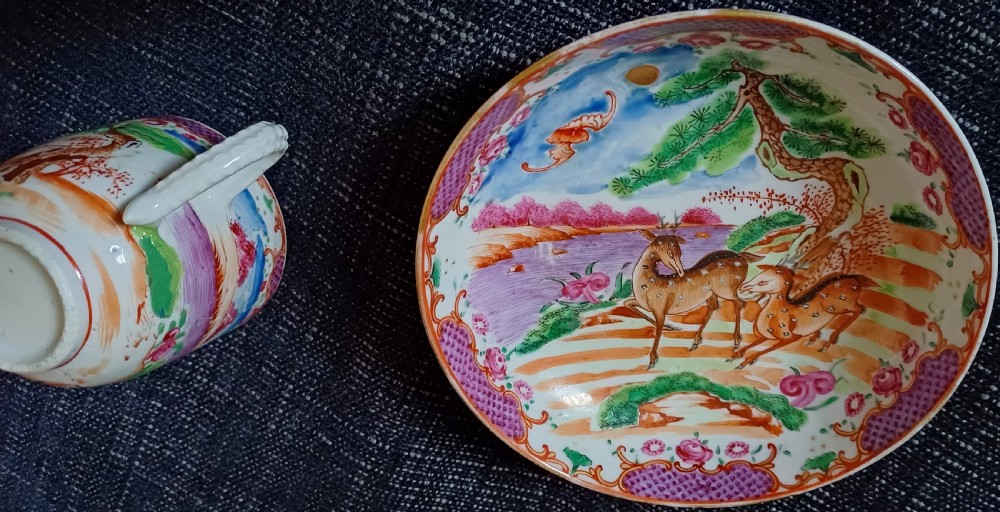 A circular 18th-century Chinese export porcelain saucer hand-painted with deer, a pine tree, and a flying bat motif within a purple lattice border. View XI
