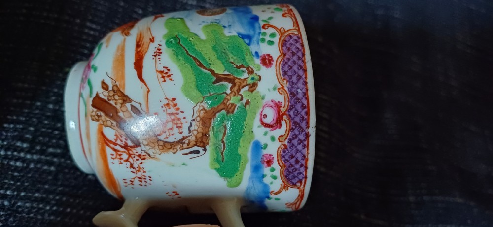 A circular 18th-century Chinese export porcelain saucer hand-painted with deer, a pine tree, and a flying bat motif within a purple lattice border. View XIV