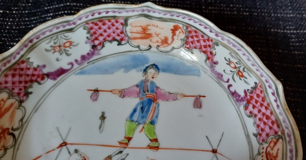 An 18th-century Chinese Mandarin palette porcelain tea bowl and saucer decorated with hand-painted acrobatic figures and pink diaper borders. View XIII