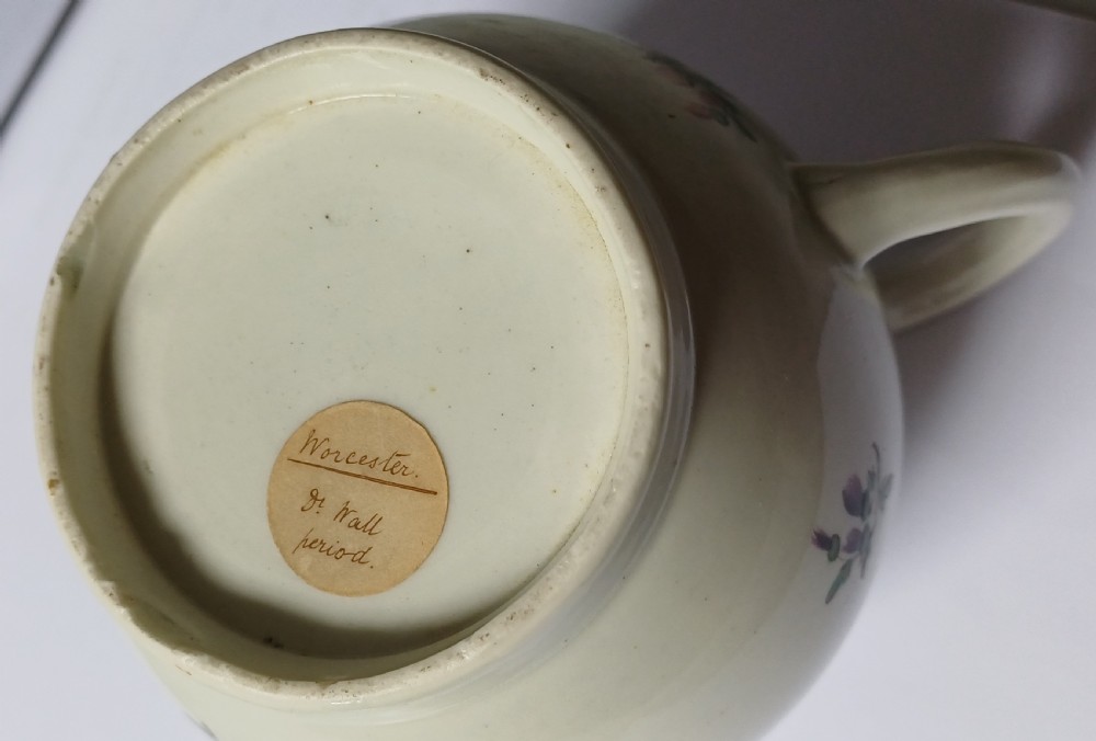 An 18th-century Dr Wall period Worcester porcelain teapot featuring hand-painted floral sprays, a loop handle, and a floral knop lid. View XI