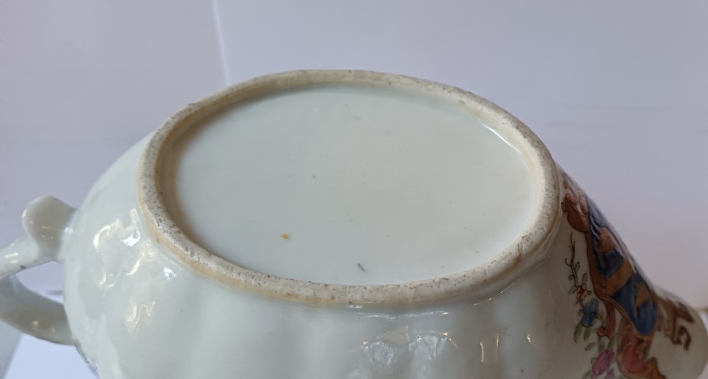 An 18th-century Chinese export famille rose porcelain sauce boat decorated with a hand-painted crest, coat of arms, and floral motifs. View VIII