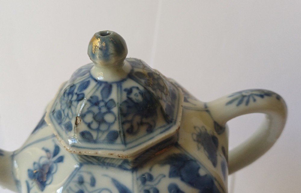 An octagonal Chinese porcelain teapot decorated with cobalt blue figures in landscapes and gold leaf highlights. View XIV