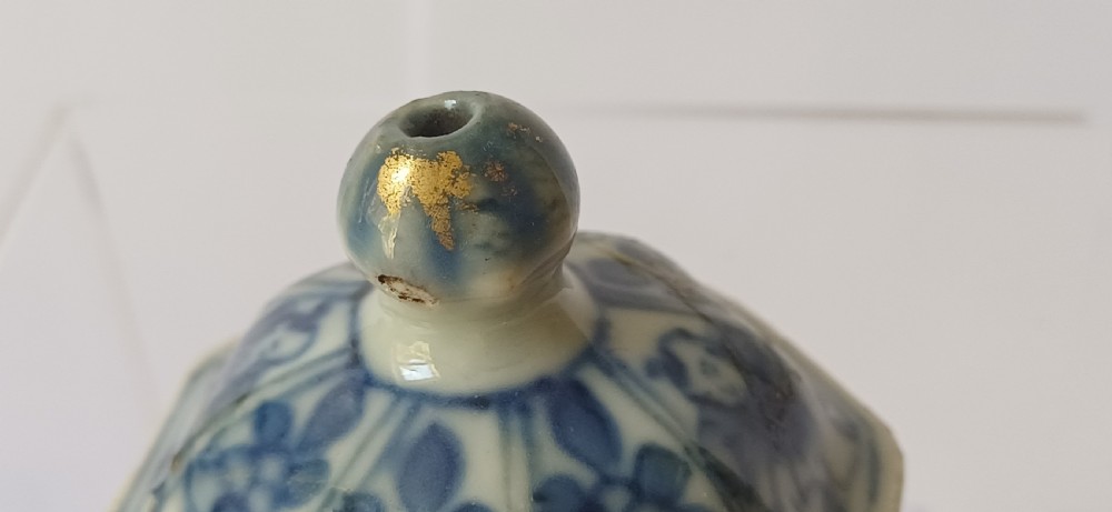 An octagonal Chinese porcelain teapot decorated with cobalt blue figures in landscapes and gold leaf highlights. View XVIII