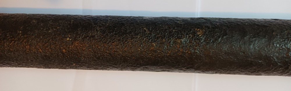 An antique brass single-draw naval telescope wrapped in textured black leather with official markings engraved near the eyepiece. View IV