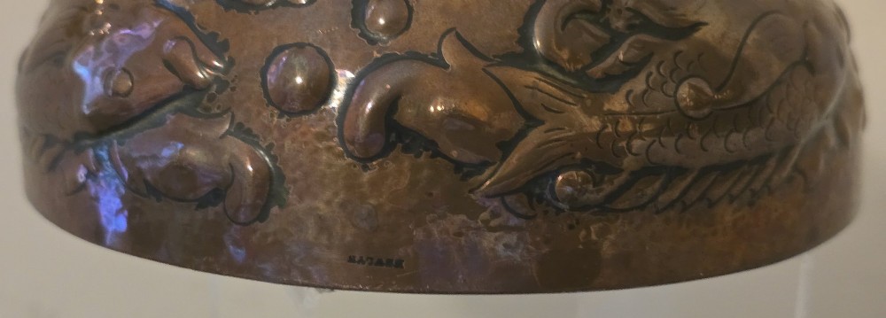 A hand-hammered dark copper rose bowl featuring embossed fish motifs and a pierced top lid. View VIII