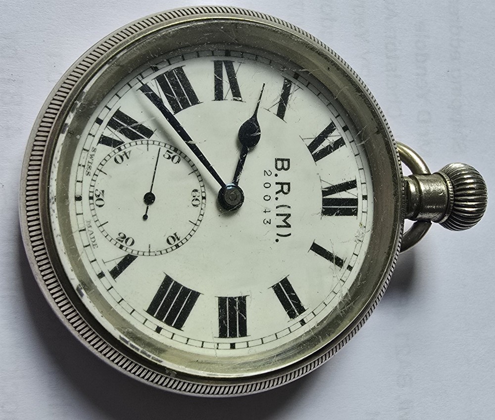 A British Rail Midland Region open-face pocket watch featuring a white dial with Roman numerals, spade hands, and a subsidiary seconds subdial. View II
