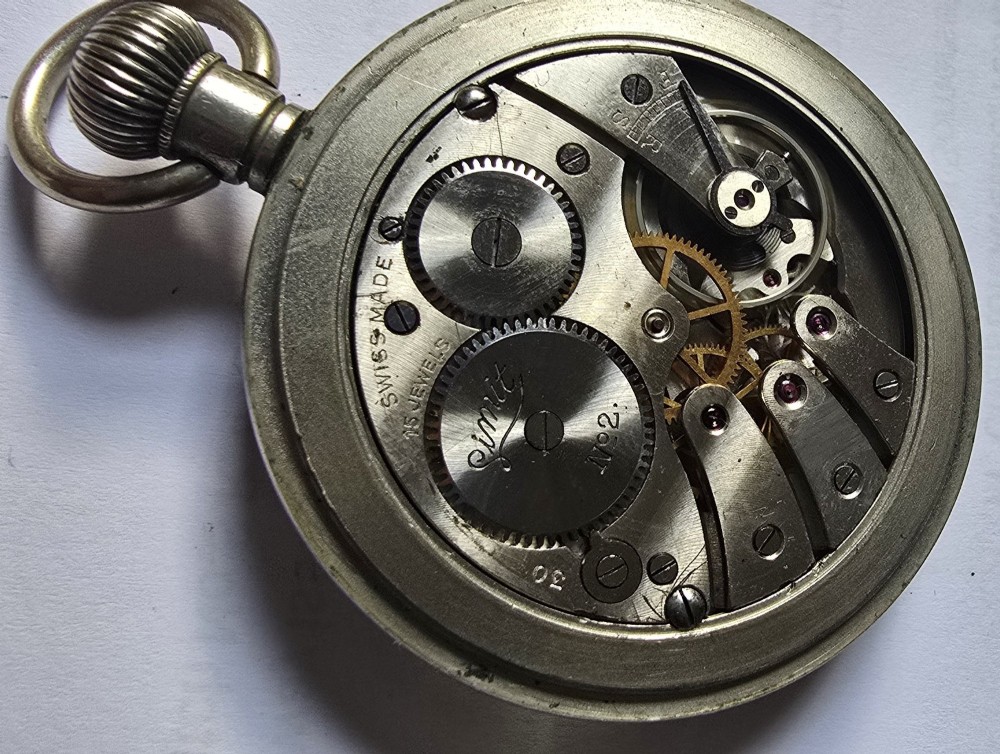 A British Rail Midland Region open-face pocket watch featuring a white dial with Roman numerals, spade hands, and a subsidiary seconds subdial. View XI