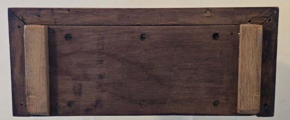 An arched wooden mantel clock featuring a white dial with Roman numerals, a brass bezel, and British Rail markings. View IX