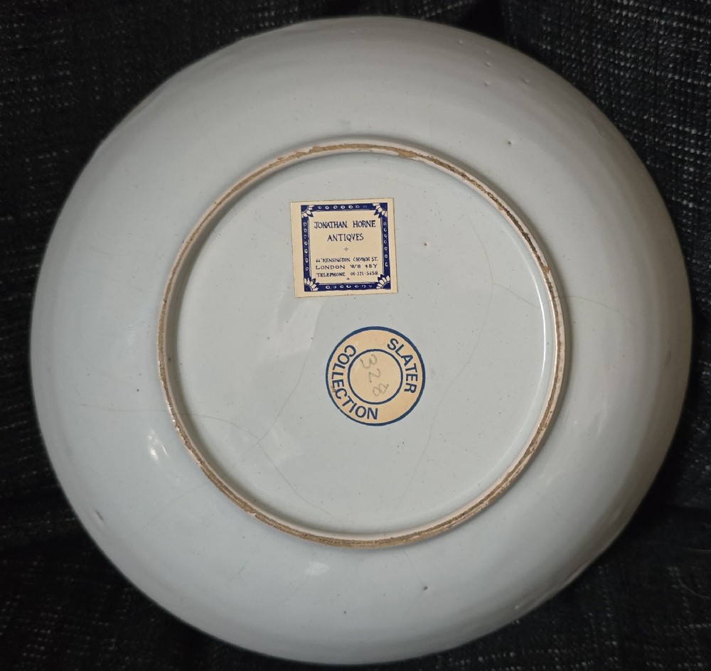 An eighteenth-century circular English delftware saucer dish painted with a cobalt blue dragon motif on a white tin glaze. View II