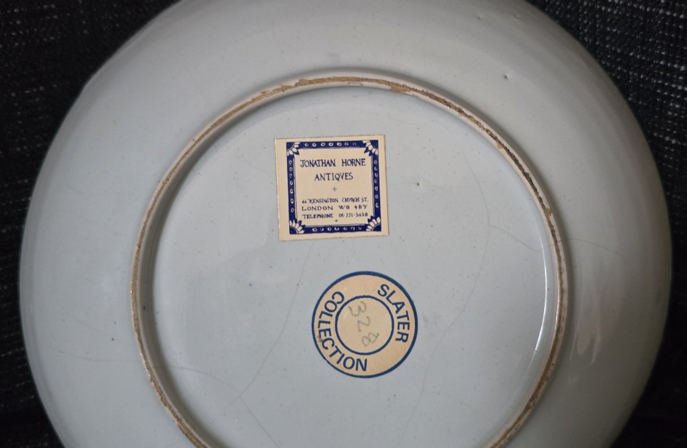An eighteenth-century circular English delftware saucer dish painted with a cobalt blue dragon motif on a white tin glaze. View III