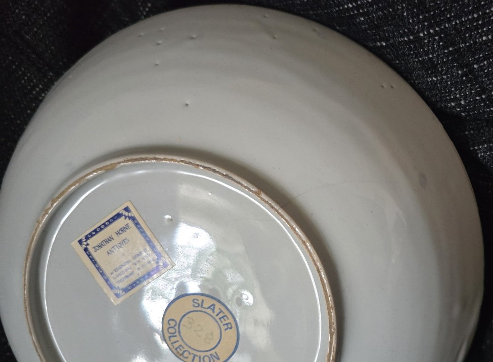 An eighteenth-century circular English delftware saucer dish painted with a cobalt blue dragon motif on a white tin glaze. View IV