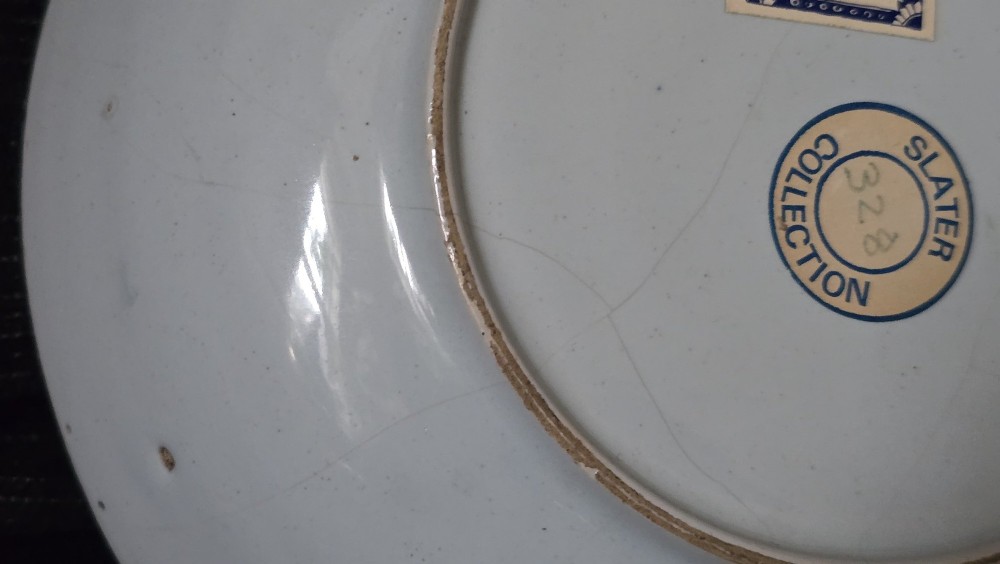 An eighteenth-century circular English delftware saucer dish painted with a cobalt blue dragon motif on a white tin glaze. View VIII