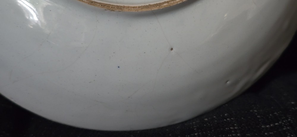 An eighteenth-century circular English delftware saucer dish painted with a cobalt blue dragon motif on a white tin glaze. View XIII