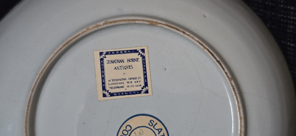 An eighteenth-century circular English delftware saucer dish painted with a cobalt blue dragon motif on a white tin glaze. View XV