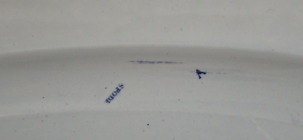 An oval blue and white underglaze transfer-printed earthenware meat platter depicting a landscape with hunters on elephants and hounds pursuing a leopard. View XIV