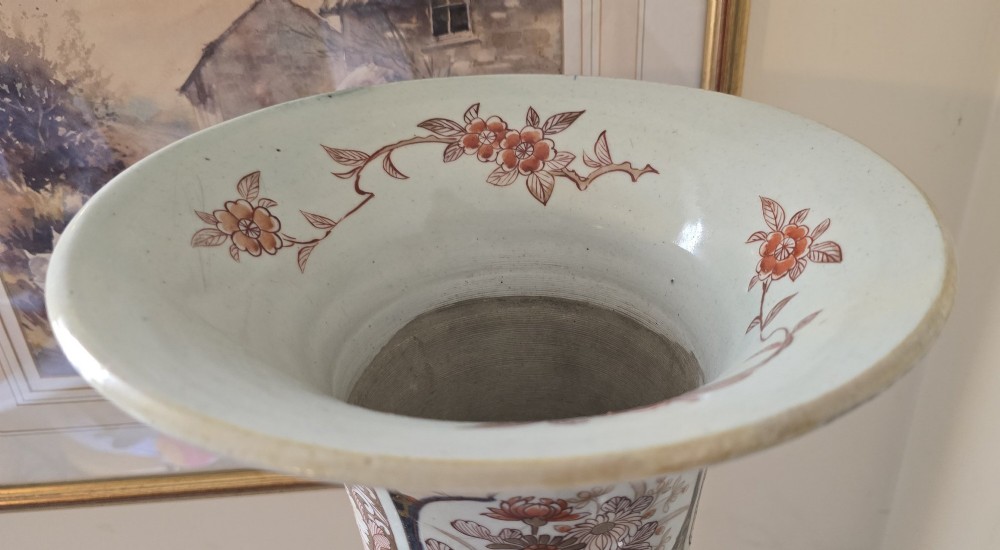 A tall Japanese Imari porcelain trumpet vase featuring hand-painted designs of horses, floral panels, and geometric borders in blue, iron red, and enamels. View VIII