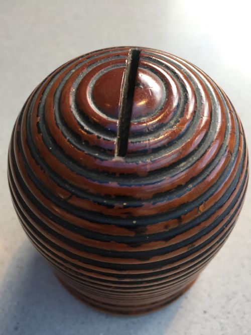 An Antique Money Box in the Shape of a Bee Hive