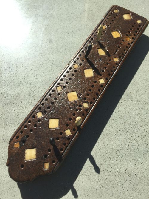 fig 1. Various Antique Cribbage Boards with pegs