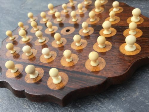 An Unusual 19th Century Rosewood Solitaire Board