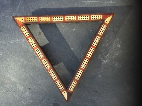 A 19th Century Triangle Shaped Ivory Inlaid Cribbage Board with Pegs